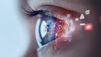 Close-up of human eye with digital technology interface overlay showing futuristic biometric scanning, data visualization and augmented reality elements in blue and red tones.