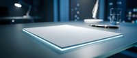 Modern minimalist tablet device on sleek office desk with soft blue lighting and contemporary workspace background for technology presentations.