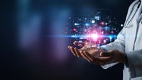 Healthcare professional holding digital network connections with glowing data points and technology interface for medical innovation and telemedicine solutions.