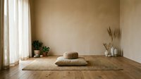 Minimalist meditation room with yoga mat, cushions and natural decor creating peaceful zen atmosphere for mindfulness practice and relaxation.