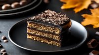 Decadent chocolate layered cake slice with rich ganache topping on black plate, perfect for bakery menus, dessert photography and culinary presentations.