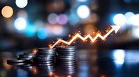 Growing stack of silver coins with glowing upward arrow graph showing financial growth and investment success against blurred bokeh background.