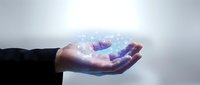 Businessman hand holding holographic digital network connection with glowing particles and data visualization for technology innovation concepts.