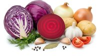 Fresh organic vegetables collection with red cabbage, beetroot, onions, potatoes, garlic and herbs isolated on white background for healthy cooking.