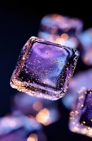 Magical purple ice cube with golden glitter particles floating inside against dark background with soft bokeh lights creating dreamy atmosphere.