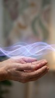 Cupped hands holding glowing purple energy waves with flowing light streams for healing, wellness, and spiritual concepts.