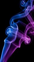Abstract colorful smoke swirls in blue and purple hues flowing gracefully against black background for modern digital art and creative projects.