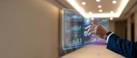 Young male professional in business attire interacting with holographic financial data display showing stock charts, graphs and market analytics in modern office setting.