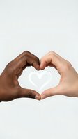 Diverse hands forming heart shape symbol representing unity, love, friendship and racial harmony on white background for social campaigns.