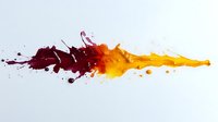 Dynamic splash of burgundy and orange liquid paint colliding with dramatic droplets and splatter effect on white background, creating abstract fluid art motion.