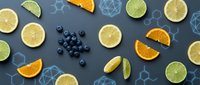 Fresh citrus fruits and blueberries with molecular structure graphics on blue background for healthy nutrition and vitamin C supplement concepts.