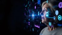 Professional blonde woman interacting with futuristic holographic interface displaying digital data analytics and artificial intelligence technology.