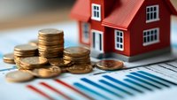 Stack of gold coins next to red miniature house model on financial chart background, representing real estate investment, property market and mortgage concept.