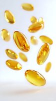 Floating golden omega-3 fish oil capsules on white background, soft focus and depth of field effect creates dynamic supplement composition.