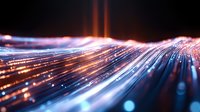 Dynamic light trails streak across dark background creating futuristic motion effect with blue and orange glowing lines, bokeh and blur for technology concepts.