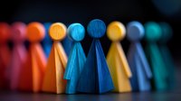 Colorful wooden figures standing in row representing diversity, teamwork, and community. Perfect for concepts of inclusion and social connection.