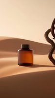 Amber glass bottle with black cap on beige background with natural shadows and wooden decorative element, minimalist cosmetic product photography setup.