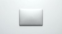 Closed silver laptop on white background, top view. Minimalist tech concept for business, education, and modern workspace design.