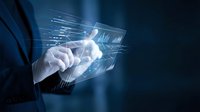 Businessman touching futuristic holographic interface with glowing digital data streams and technology elements on dark blue background for business concepts.