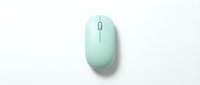 Mint green wireless computer mouse on white background, isolated modern peripheral device for office and home workspace setup.