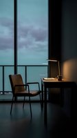 Modern workspace with brown leather chair and desk lamp beside floor-to-ceiling windows overlooking twilight sky and ocean horizon. Interior design and remote work concept.