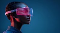 Young African American woman wearing futuristic pink glowing virtual reality headset against dark blue background, profile view showcasing modern technology concept.