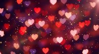 Romantic bokeh hearts background with warm red and pink tones, sparkling lights for Valentine's Day, love themes, wedding invitations and greeting cards.