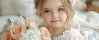 Young girl with blue eyes wearing white lace dress, surrounded by soft pink roses and white flowers, gentle smile in natural light setting creates dreamy atmosphere.