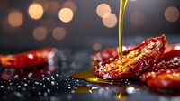 Pouring golden olive oil over sun-dried tomatoes on dark background with bokeh lights and water drops, macro food photography for restaurant menu.