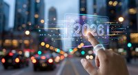 Hand touching futuristic holographic 2026 display with digital interface elements against blurred city lights background at night.