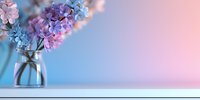 Delicate pink and purple hyacinths in glass vase against pastel blue and pink gradient background with copy space, creating soft spring atmosphere.