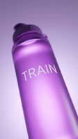 Vibrant magenta sports water bottle with motivational text on purple gradient background, perfect for fitness, wellness, and athletic lifestyle marketing campaigns.