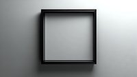 Empty black square frame on gray wall, creating minimalist shadow effect for contemporary art display or home decor.