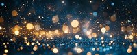 Festive glowing bokeh lights on dark blue background with golden sparkles and blurred circles creating magical holiday atmosphere.
