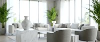 Modern minimalist living room interior with white furniture, marble coffee table, and green plants creating bright contemporary home decor space.