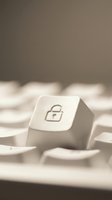 White computer keyboard key with padlock security icon symbol for cybersecurity data protection and online safety concepts in soft neutral lighting.