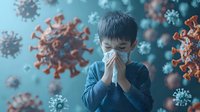 Young Asian boy wearing protective face mask sneezing with coronavirus cells floating in blue background, depicting health protection during pandemic.