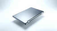 Sleek silver laptop closed at an angle on white background, showcasing modern metallic design and slim profile for technology concepts.