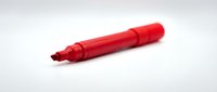 Red permanent marker with chisel tip isolated on white background, ready for design mockups, educational materials, office supplies, and product presentations.