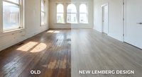 Empty room interior showing hardwood floor renovation comparison with natural light from arched windows and white walls for home improvement projects.
