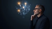 Mature Caucasian businessman with gray beard contemplating glowing network of connected lightbulbs representing innovative ideas and creative thinking process.