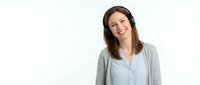Professional businesswoman in casual office attire smiling confidently on white background, perfect for corporate communications and workplace content.
