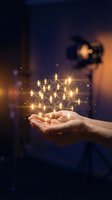 Hand holding glowing network of connected people icons with golden light particles, representing social media, teamwork, communication, and digital connectivity for business concepts.