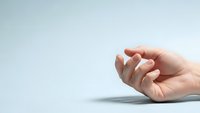 Open female hand with palm up in receiving gesture on clean white background for product placement and commercial design use.