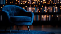 Elegant blue velvet armchair against blurred bokeh lights background creating cozy atmosphere. Modern furniture in dark moody interior with warm glowing ambiance.