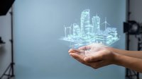 Businesswoman holding glowing holographic cityscape with skyscrapers and wind turbines, representing sustainable urban development, smart city technology, and future infrastructure planning.