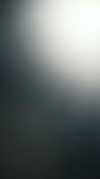 Soft gradient blur background transitioning from dark gray to light cream, smooth abstract texture for modern design projects and presentations.