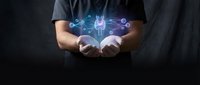 Business professional holding glowing digital network connections with data nodes and communication links in cupped hands against dark background.