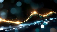 Glowing golden light trail with sparkling particles and bokeh effects on dark background, creating magical energy flow pattern for abstract designs.