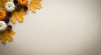 Autumn flat lay with orange and white pumpkins, golden maple leaves and pine cones on neutral beige background with copy space for seasonal design.